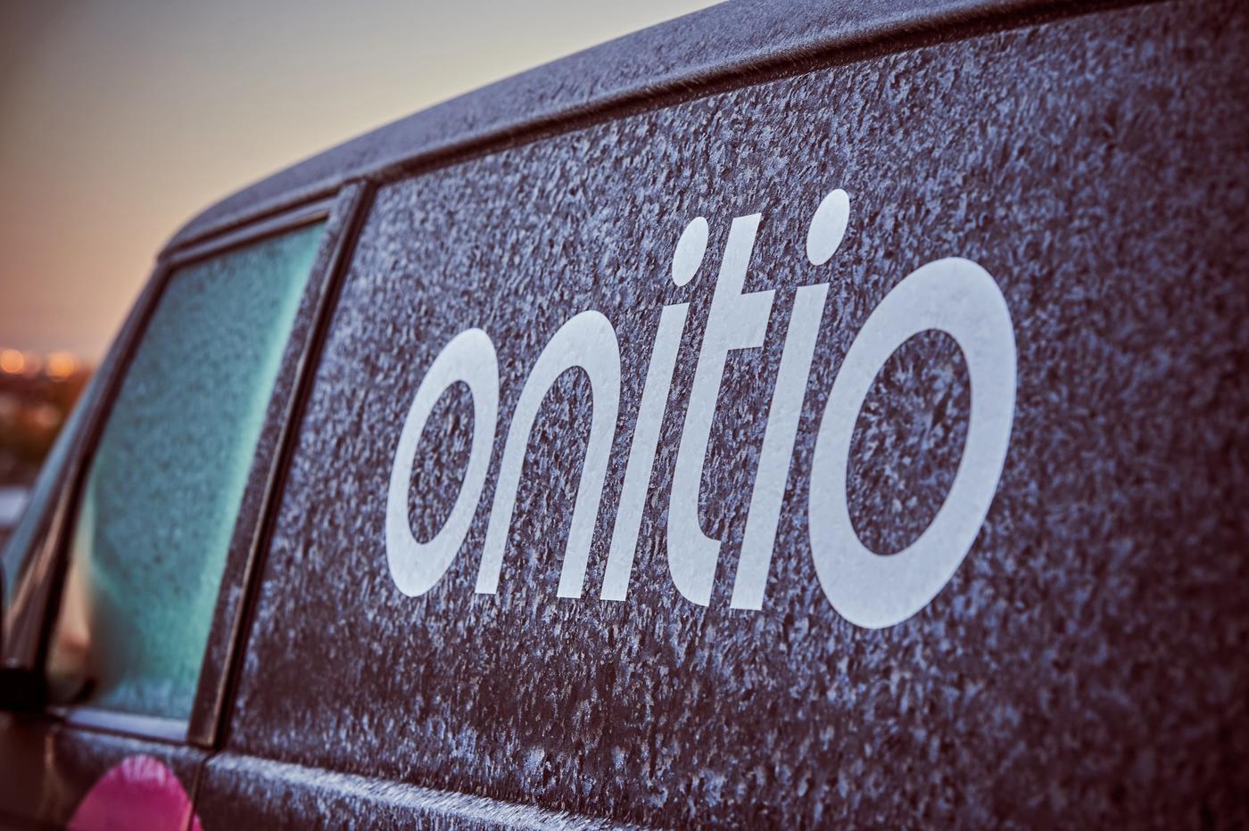 A branded Onitio company car in a winter env
