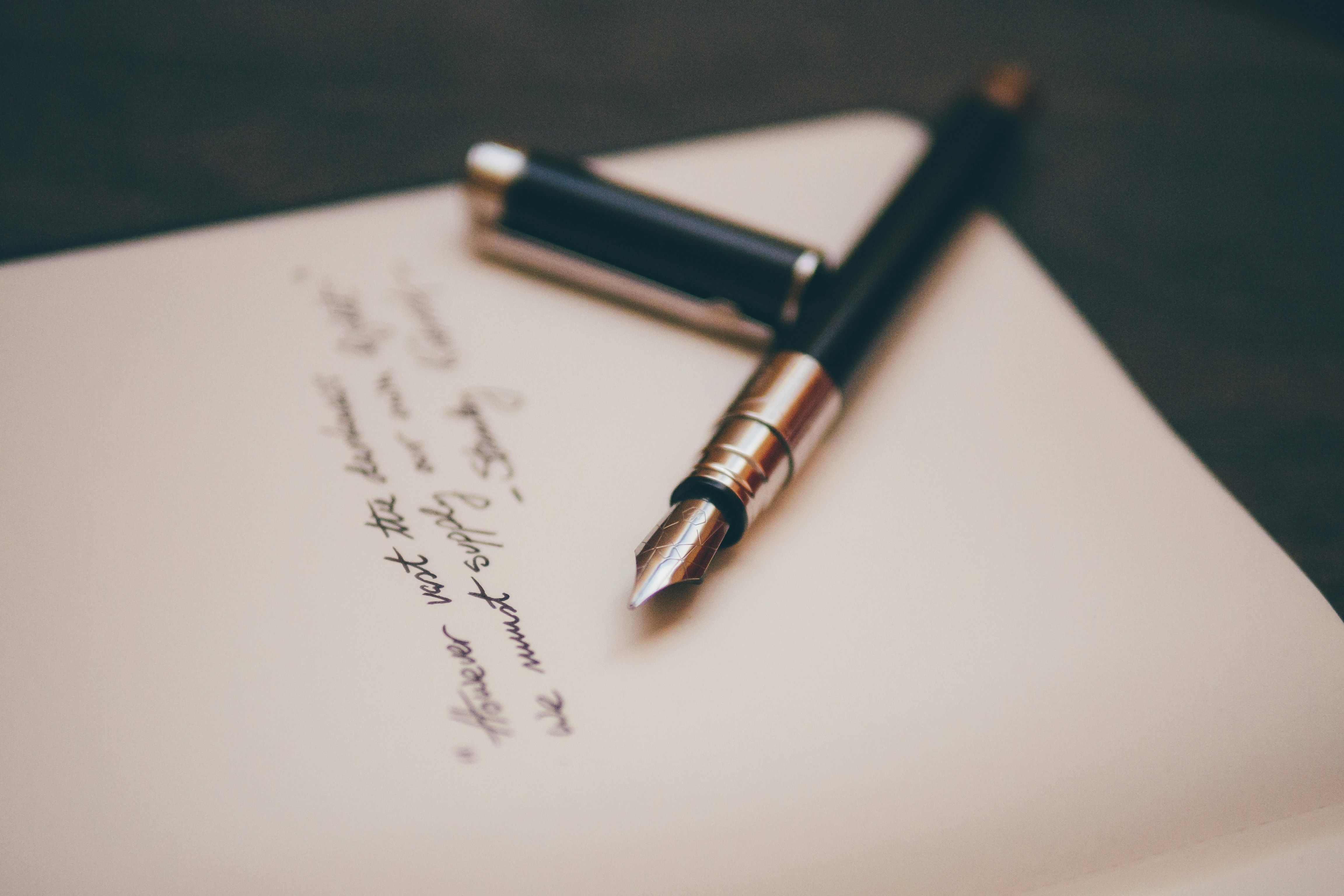 fountain pen and letter with text