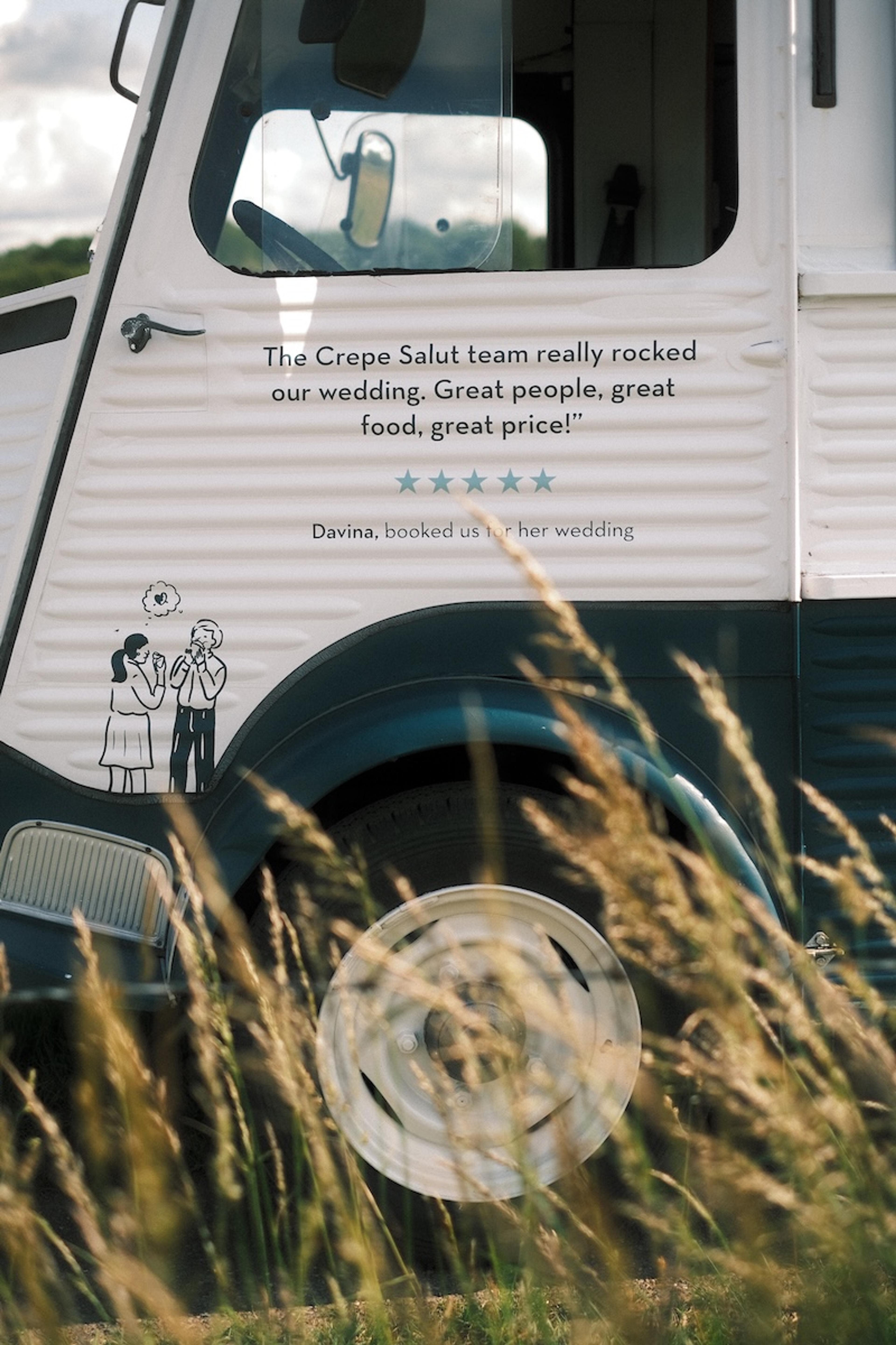 A customer review printed on the door of the crepe van
