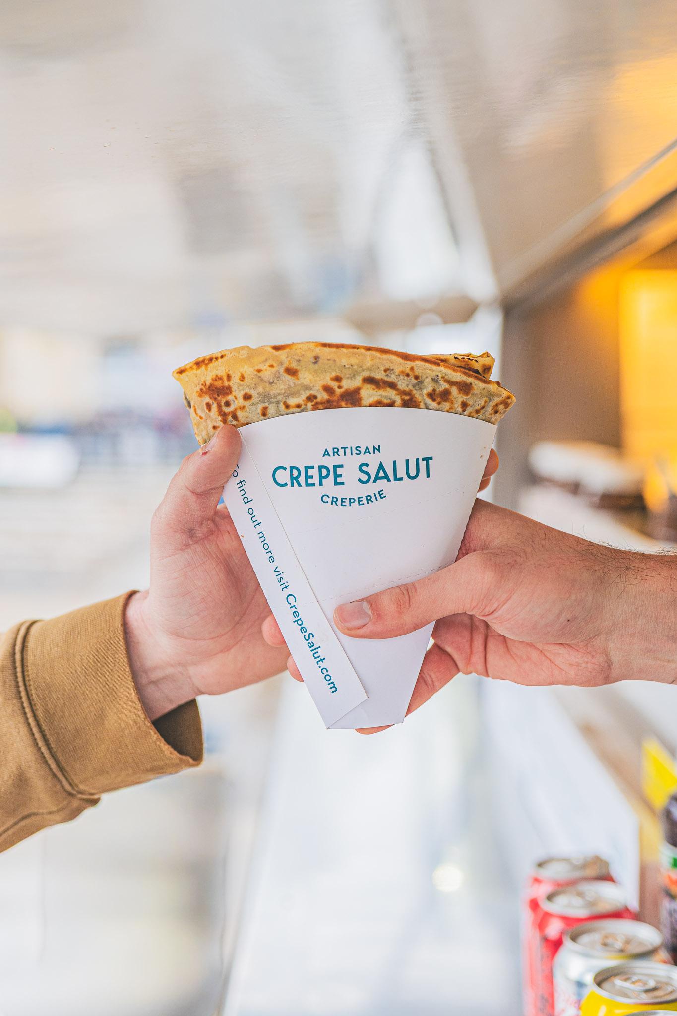 A crepe in a branded cone, fresh from the van