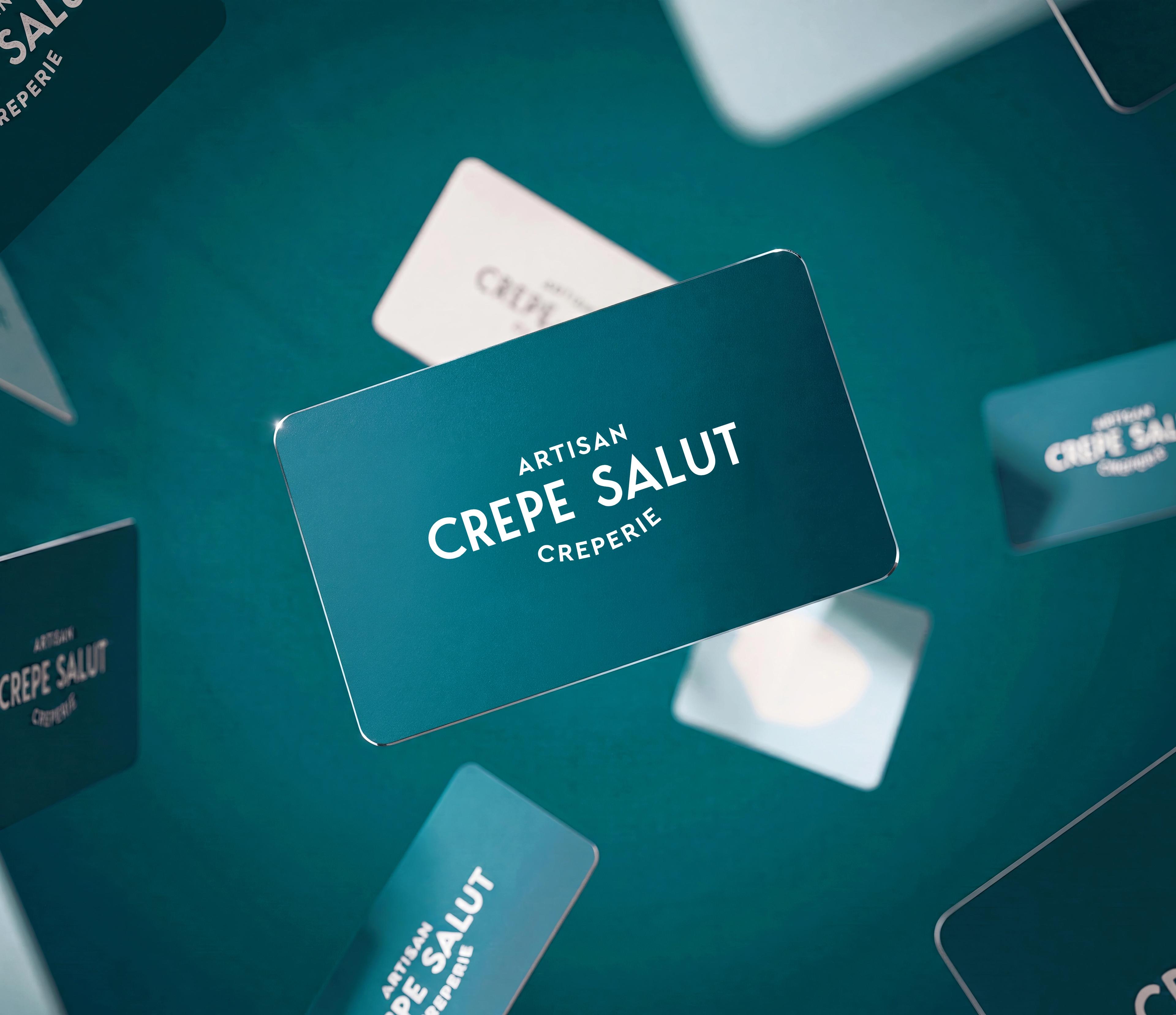 Crepe Salut loyalty cards floating on a teal background