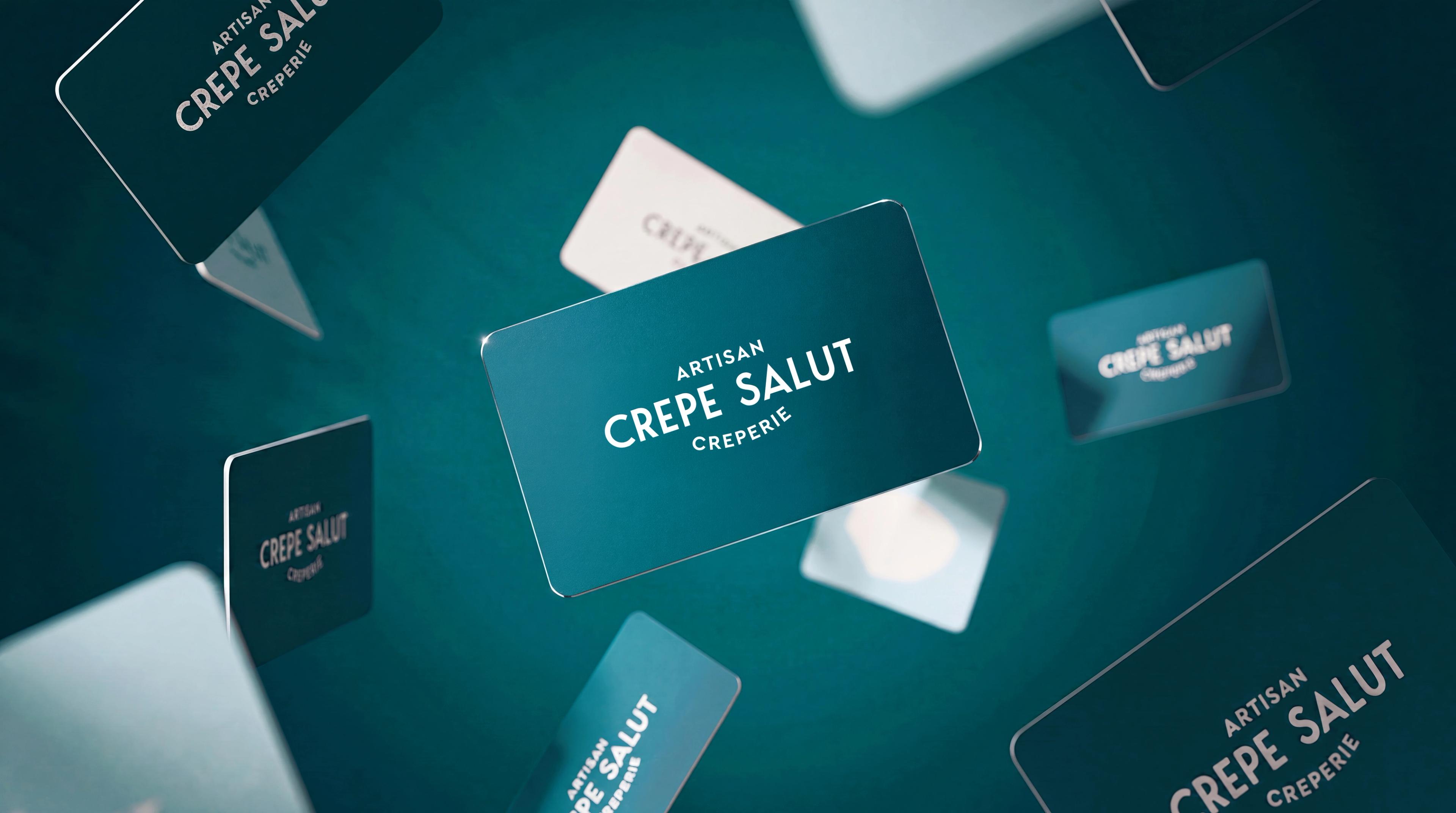 Crepe Salut loyalty cards floating on a teal background