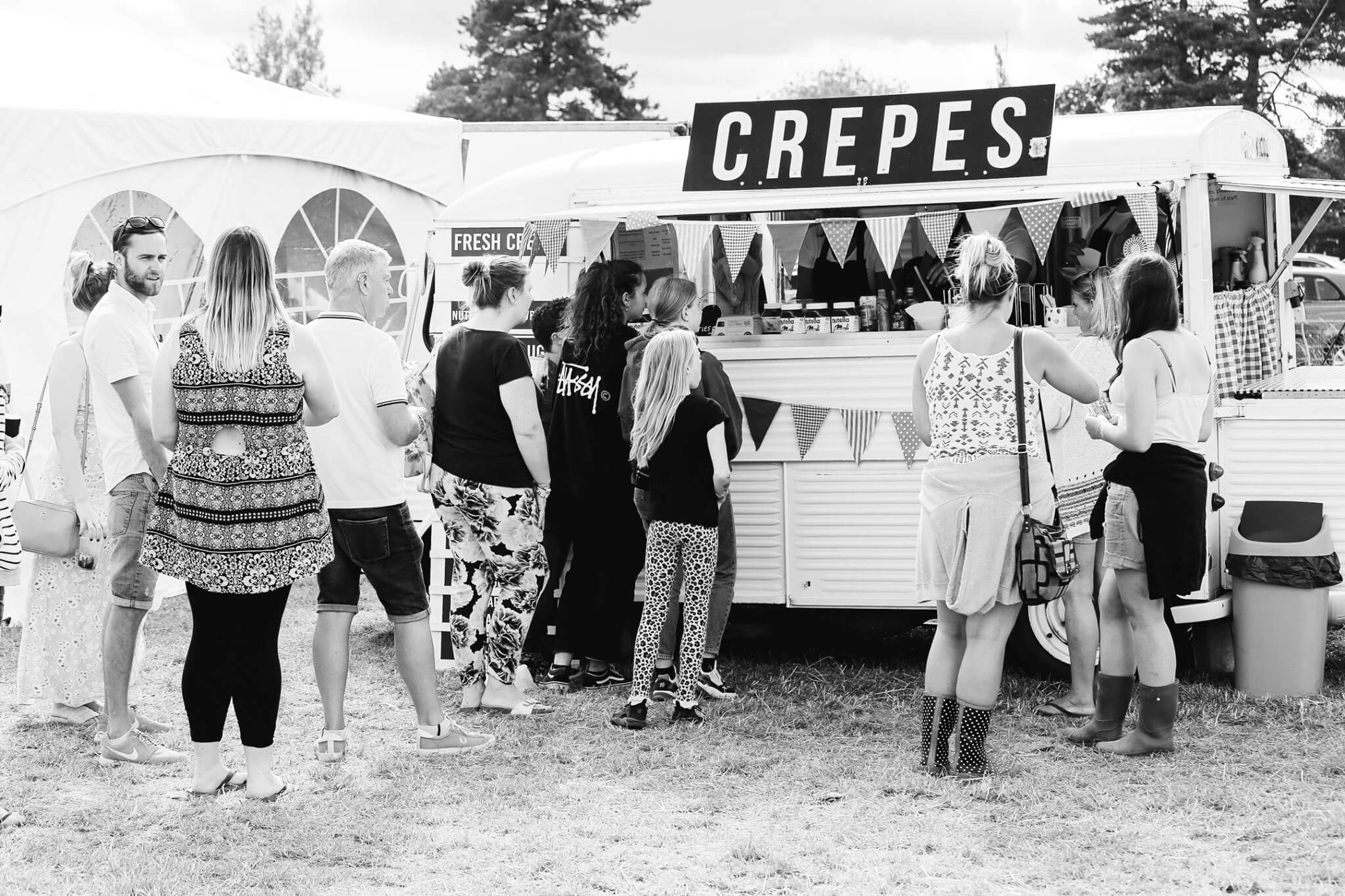 The queue at the crepe van at a festival