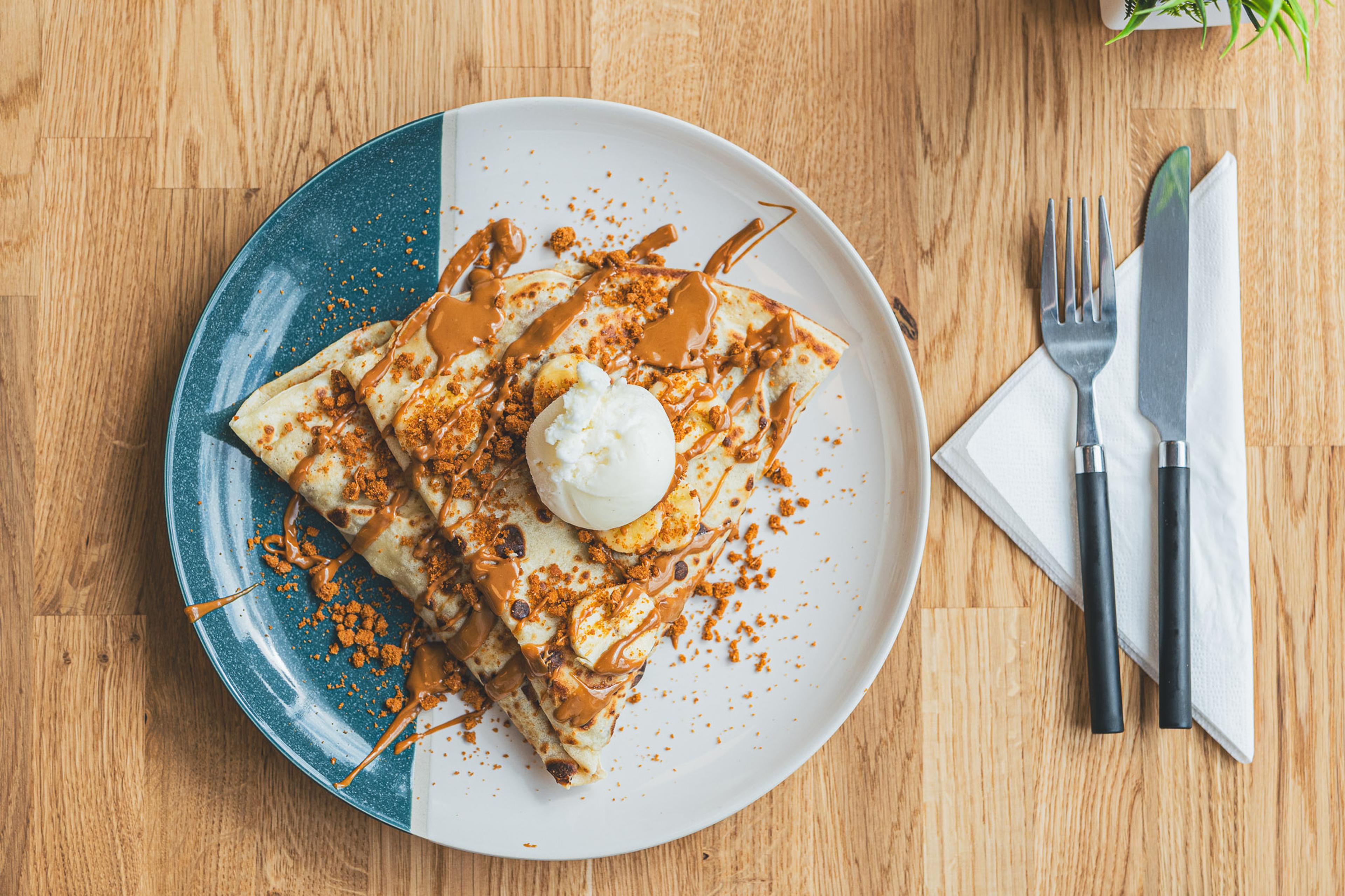 A Biscoff crepe with ice cream, ready to share
