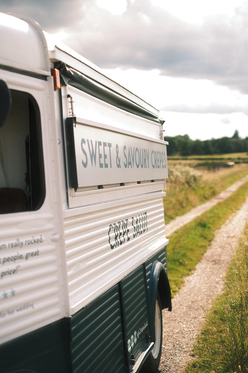 The van with its serving hatch open on a country track