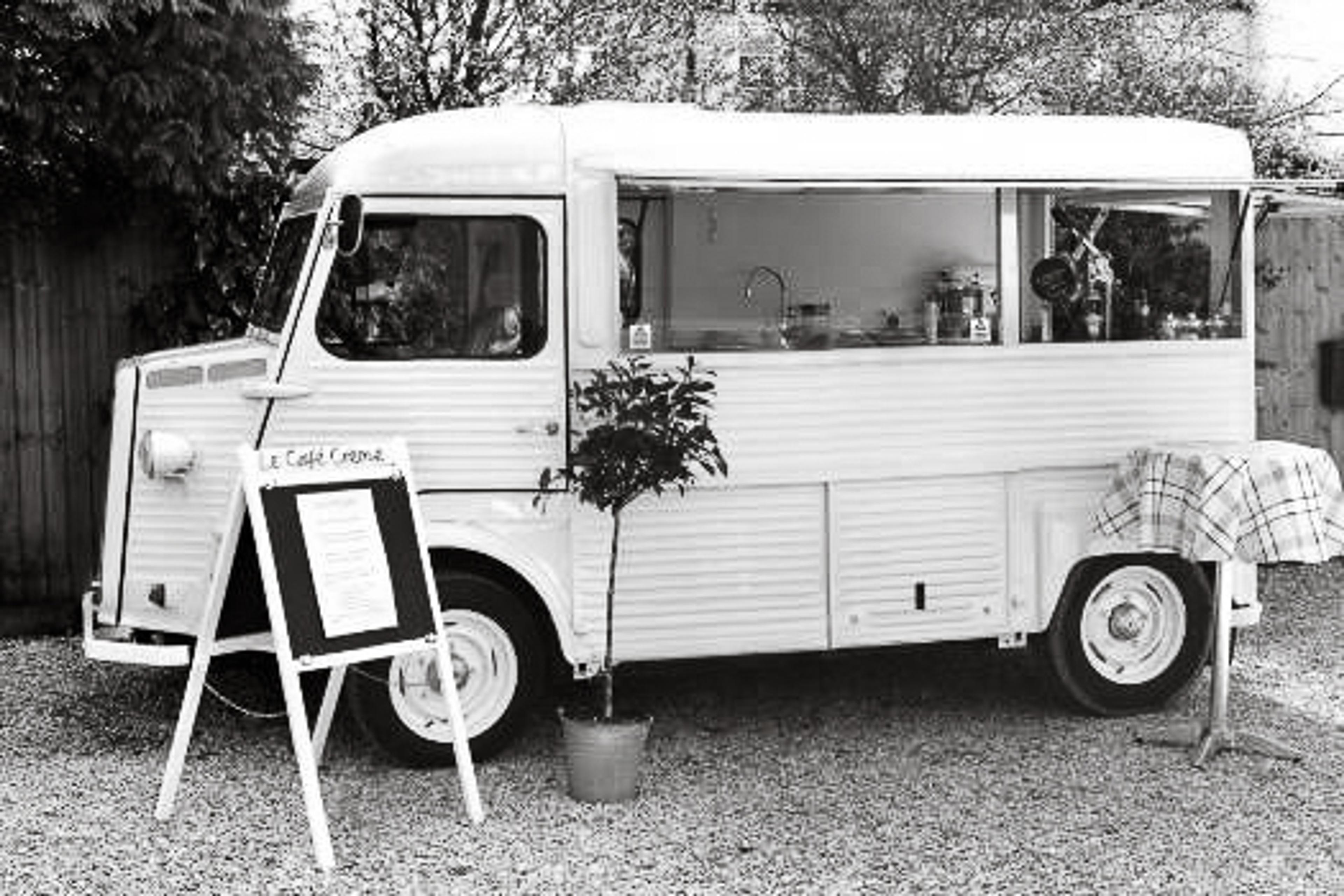Josephine, our vintage Citroën van, with a chalkboard sign
