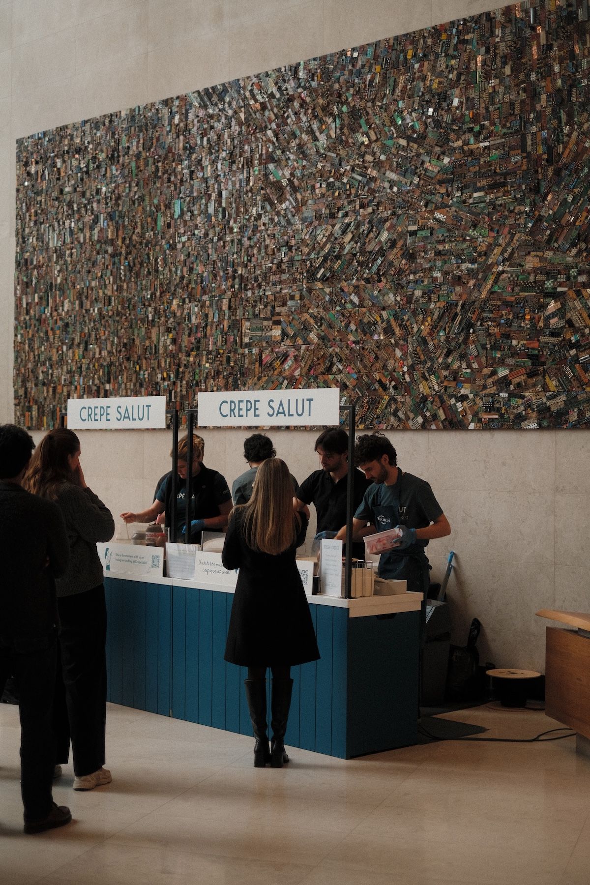 A Crepe Salut counter serving guests in an office lobby