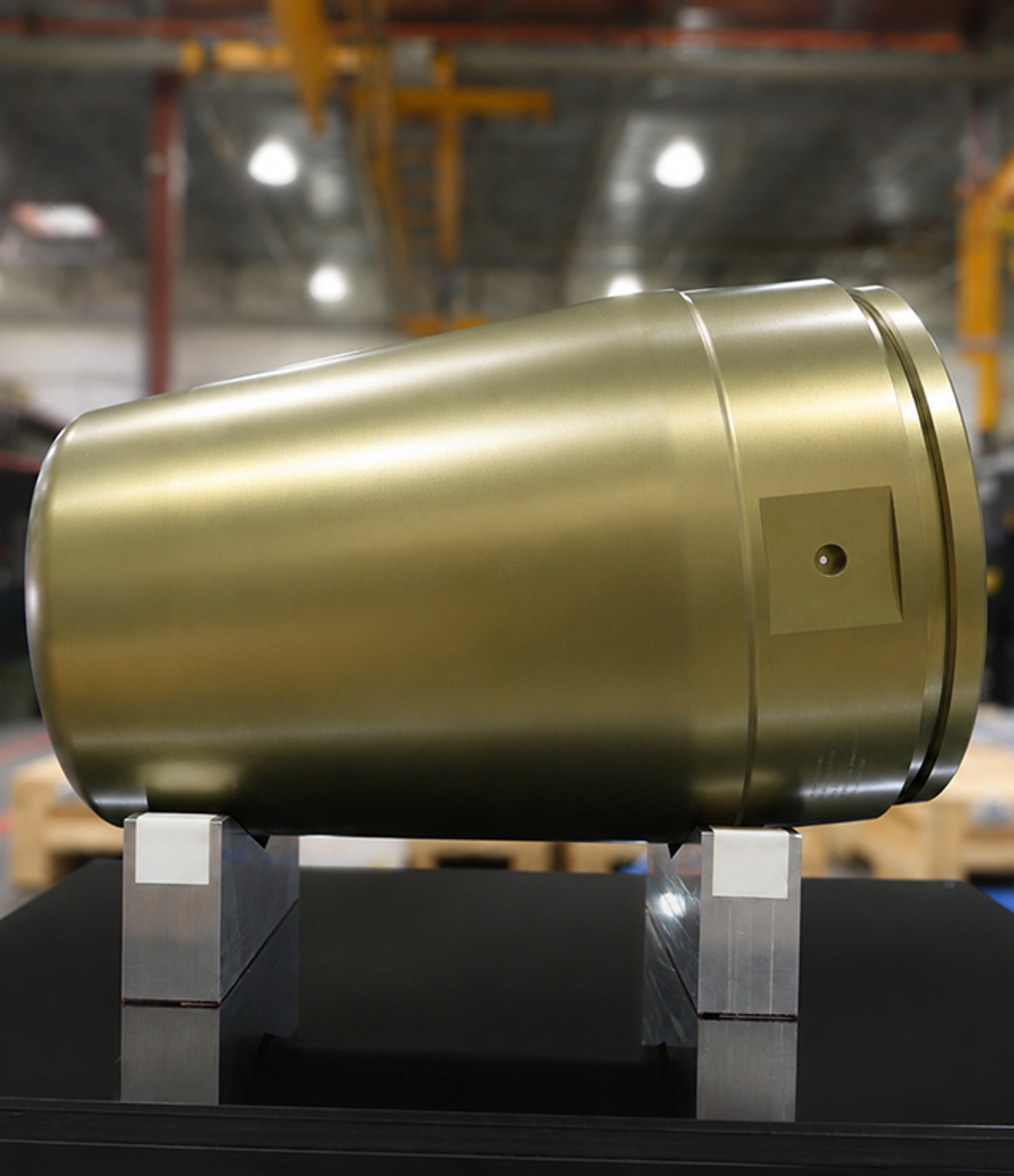Precision cylinder with gold coating on a support bench
