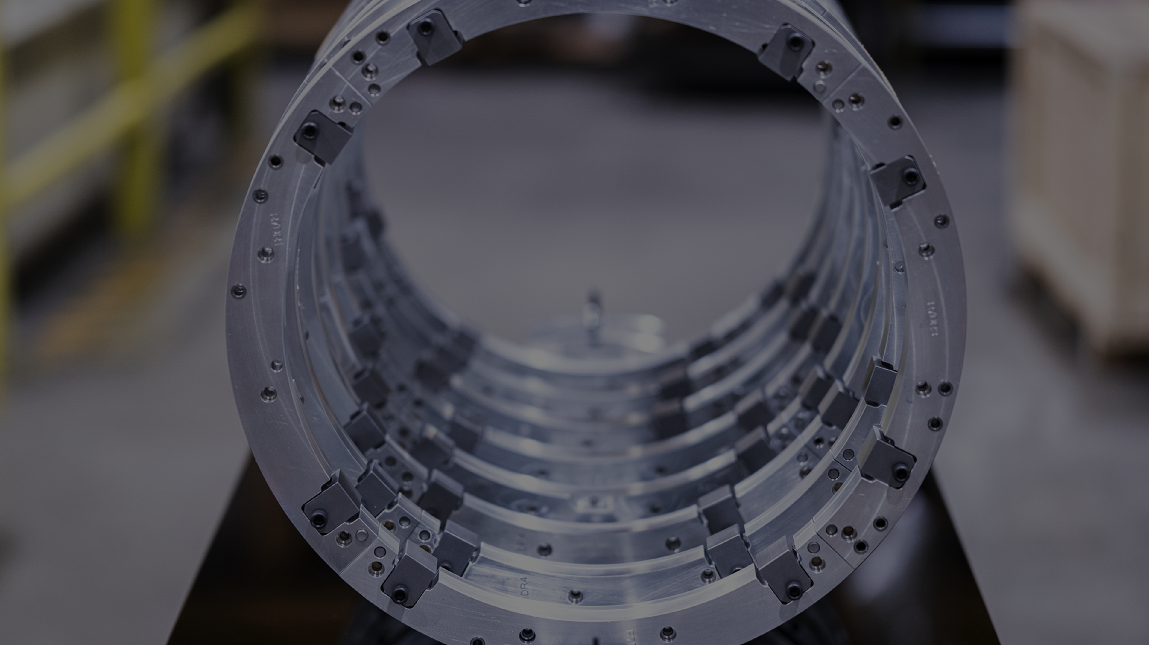 Nested machined ring segments staged on the shop floor