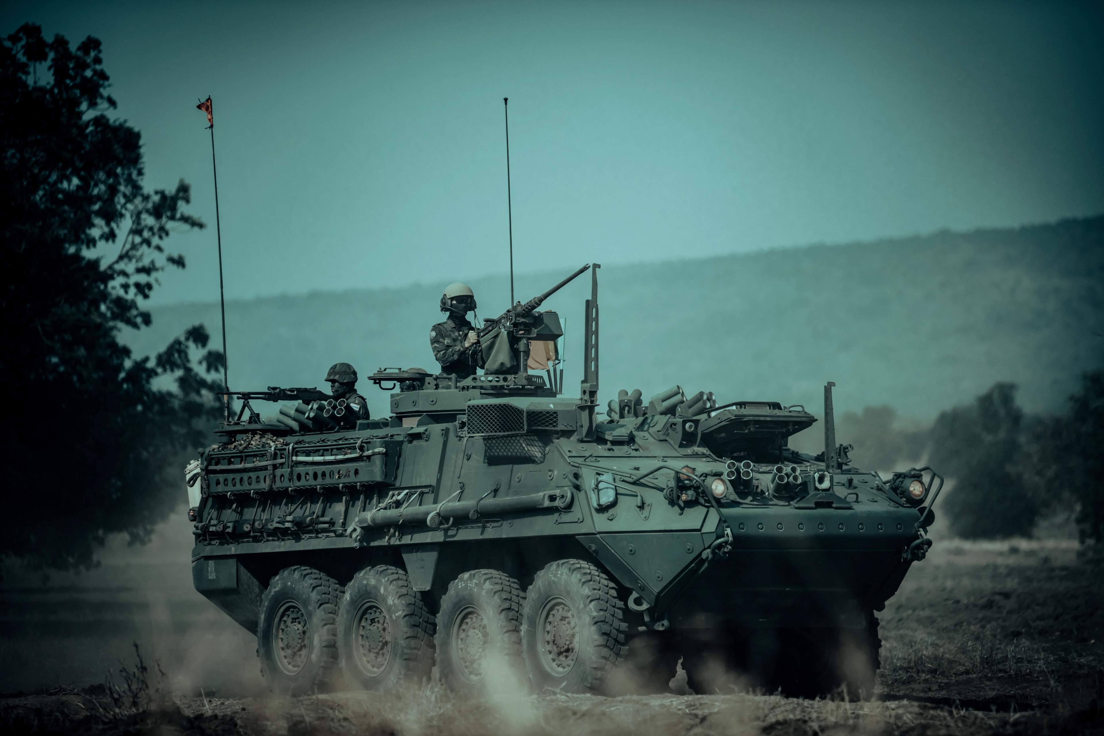 Crew member manning the turret of a Stryker armoured fighting vehicle