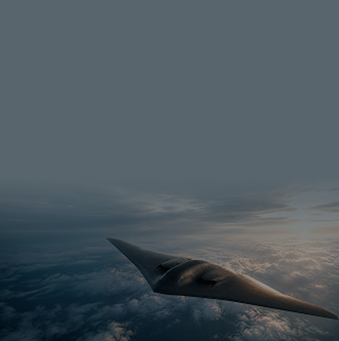 A stealth flying-wing aircraft in flight above a layer of clouds