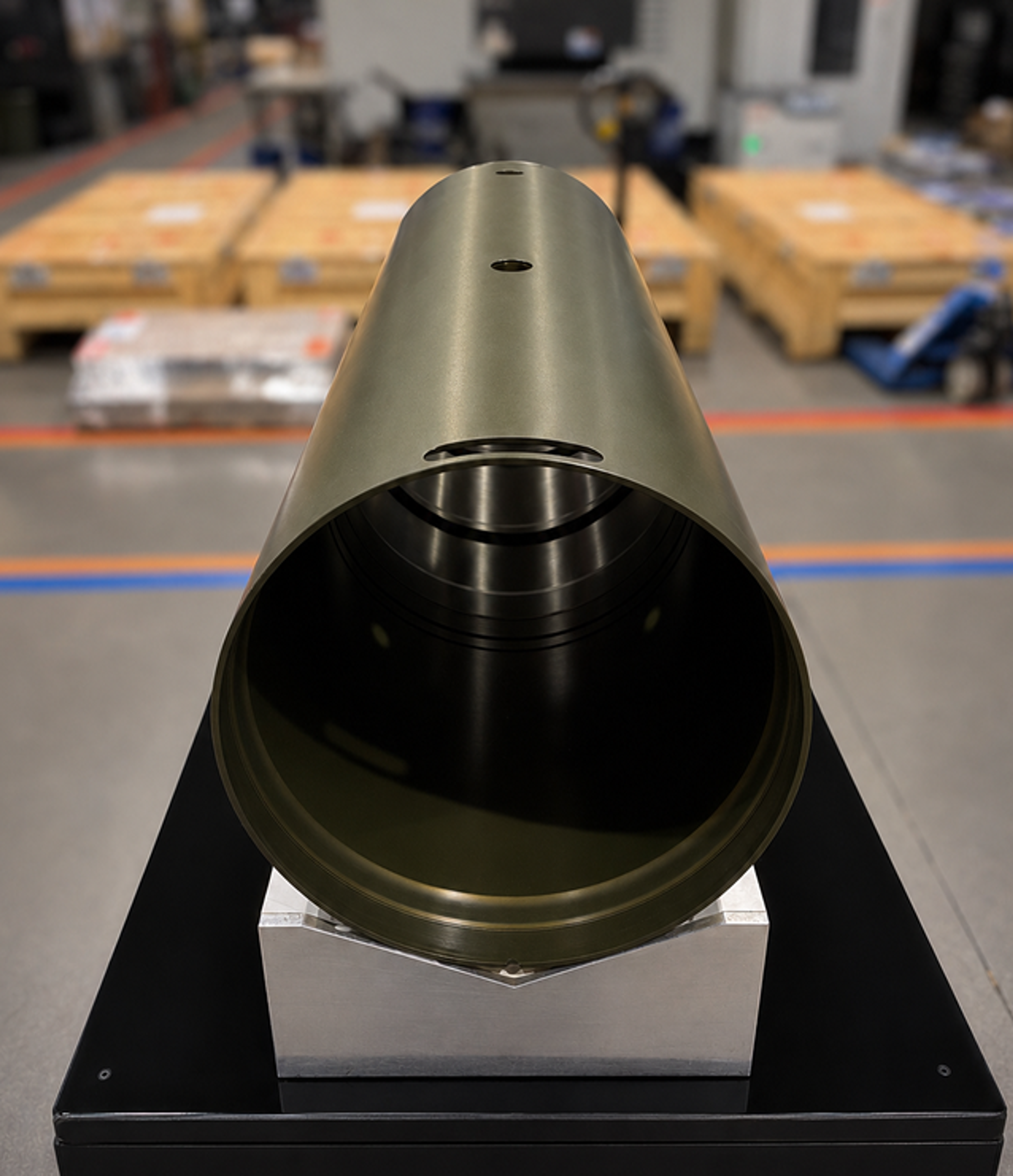 Gold-finished aerospace cone mounted on an inspection stand