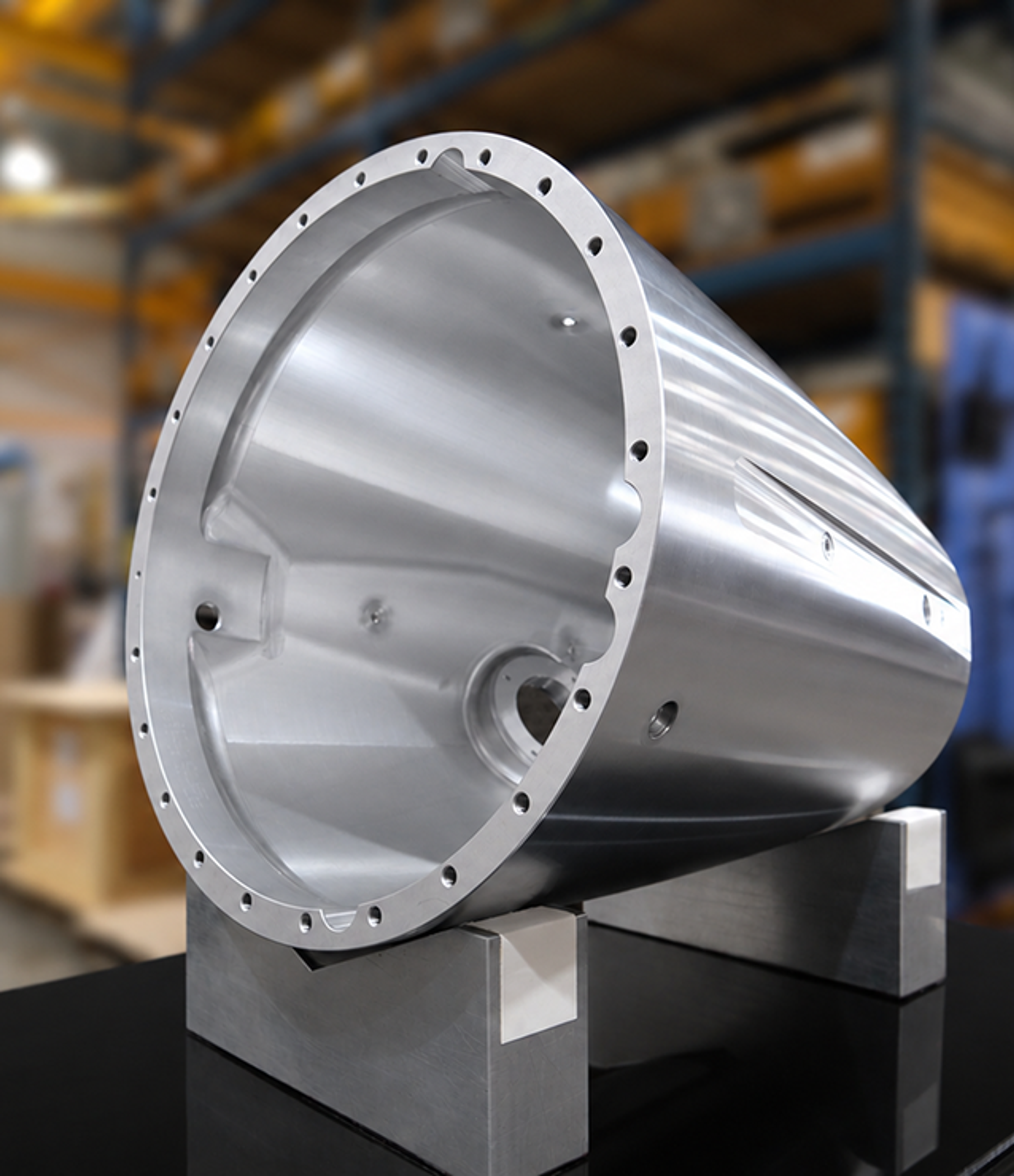 Conical aluminum housing with mounting flange on a stand
