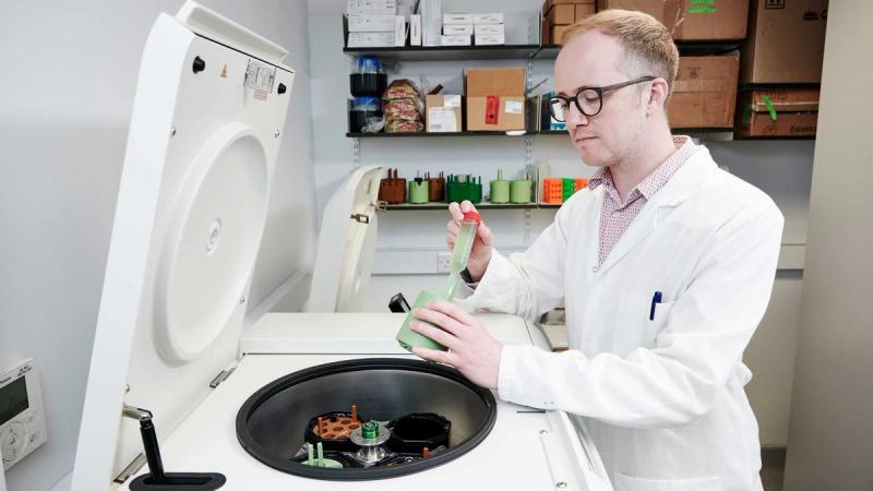 Professor Stephen Wallace harvesting engineered bacteria for analysis.