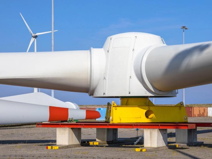 Large wind turbine on the ground, awaiting construction