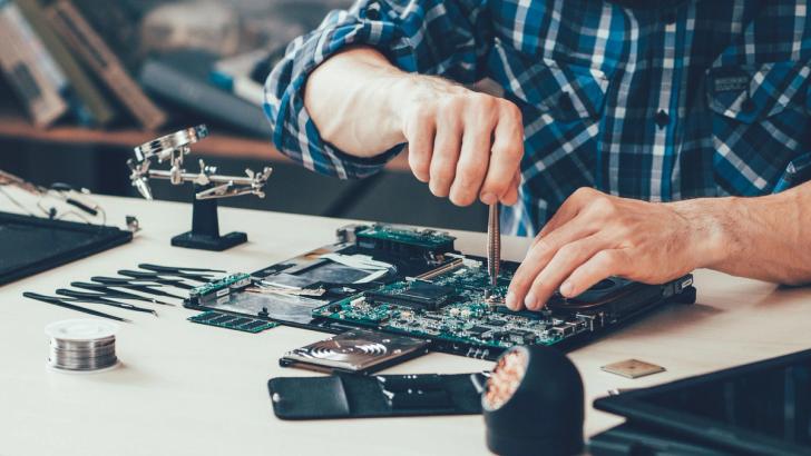 Close-up of somebody repairing a motherboard