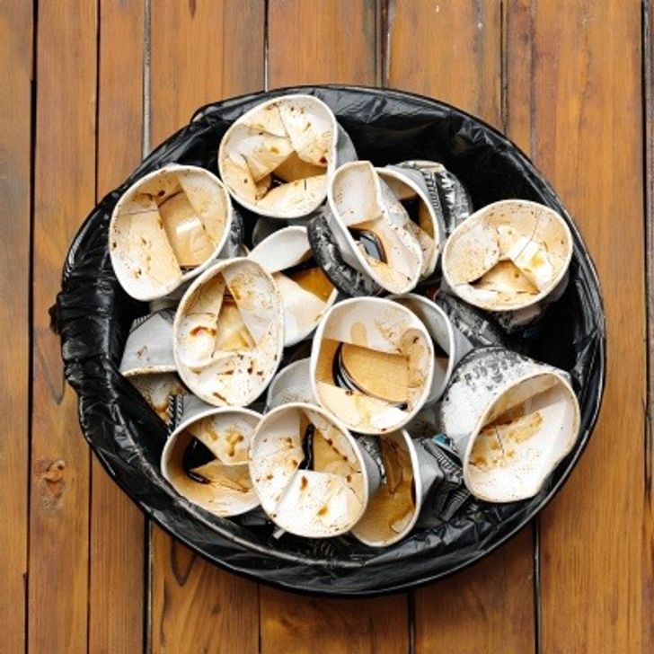 Single use cups in a bin