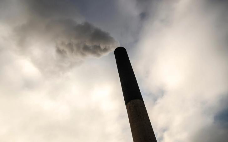 waste incinerator chimney stack emitting CO2