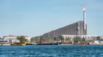 Incineration plant in the district of Amager, Copenhagen, Denmark, with modern buildings and boats