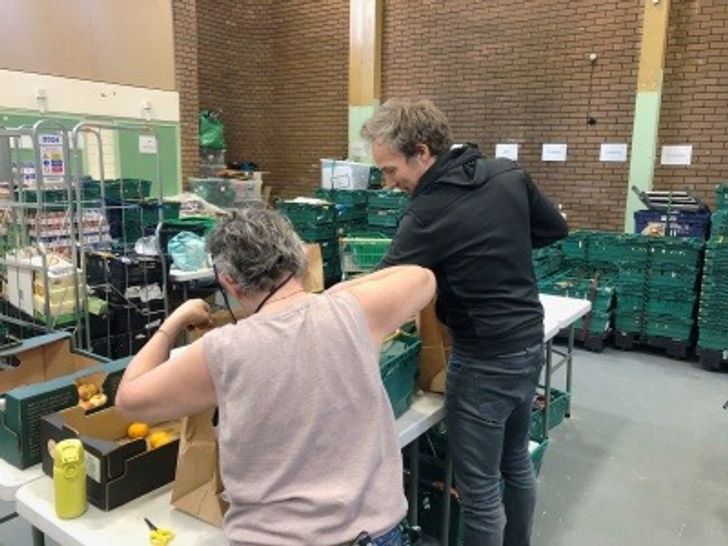 Two people at a food bank in Hackney
