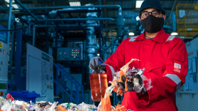 Deeptech Recycling worker holding plastic waste