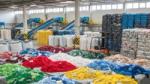 Colourful sorted textiles at Fashion For Good's sorting centre