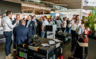 Delegates and exhibitors talking to each other at the E-Waste expo in Frankfurt