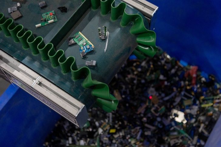 E-waste on conveyer belt at Royal Mint factory