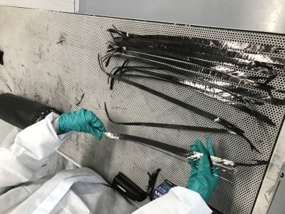 worker inspecting recycled carbon fibre