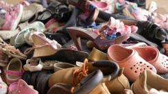 Photo of used shoes collected for disposal