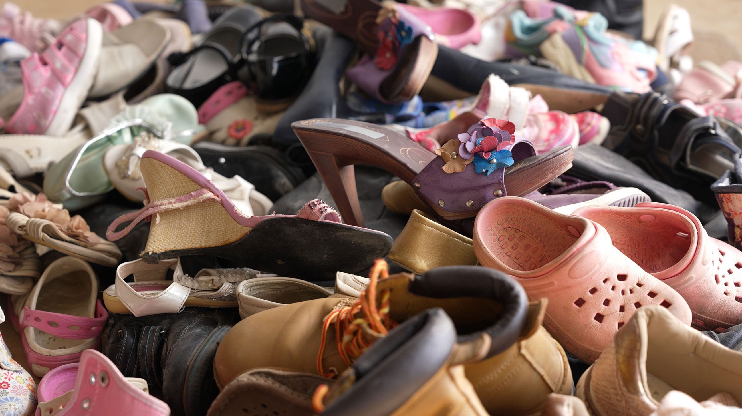 Photo of used shoes collected for disposal