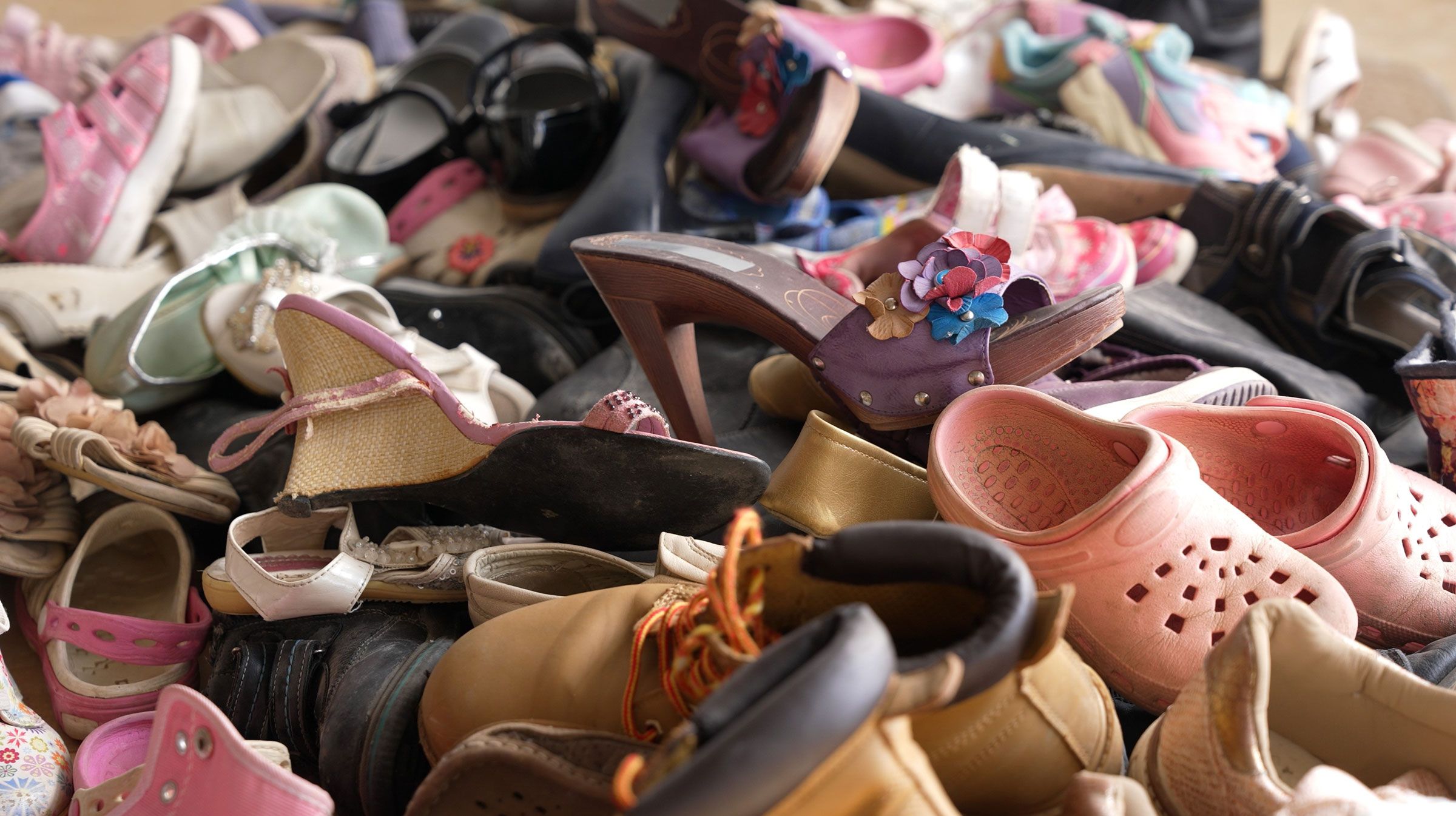 Photo of used shoes collected for disposal