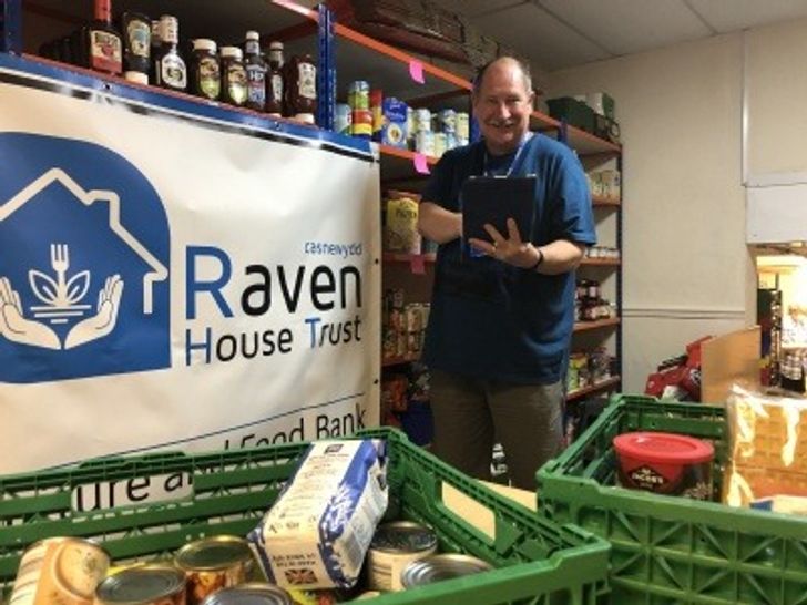 Peter Hill of Raven's House Trust holding an ONS-donated iPad
