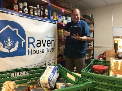 Peter Hill of Raven's House Trust holding an ONS-donated iPad