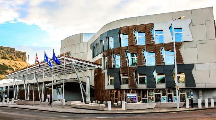Picture of Scottish Parliament with flags outside