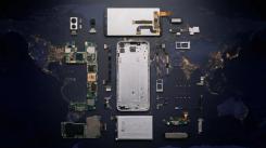 Smartphone parts set over picture of a world map at night