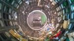 Photo looking inside a circular trommel screen with mixed household waste being spun