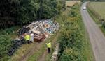 Aerial view of officers assessing flytipped waste