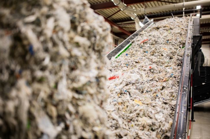 Beverage carton waste at recycling plant