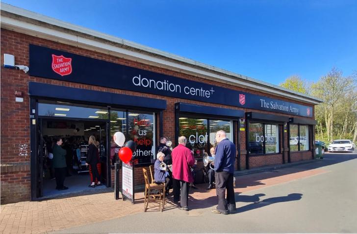 Exterior shot of people outside a Salvation Army donation centre