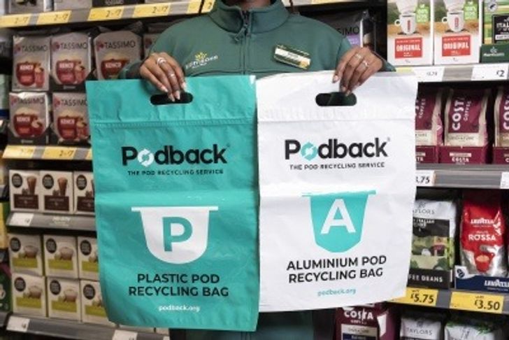 Morrisons employee holding Podback collection bags