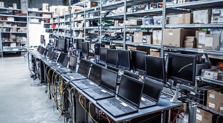 Laptops and computer screens lined up