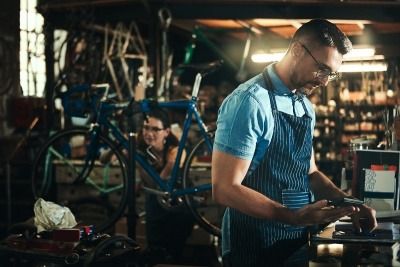 Person in a bicycle repair workshop