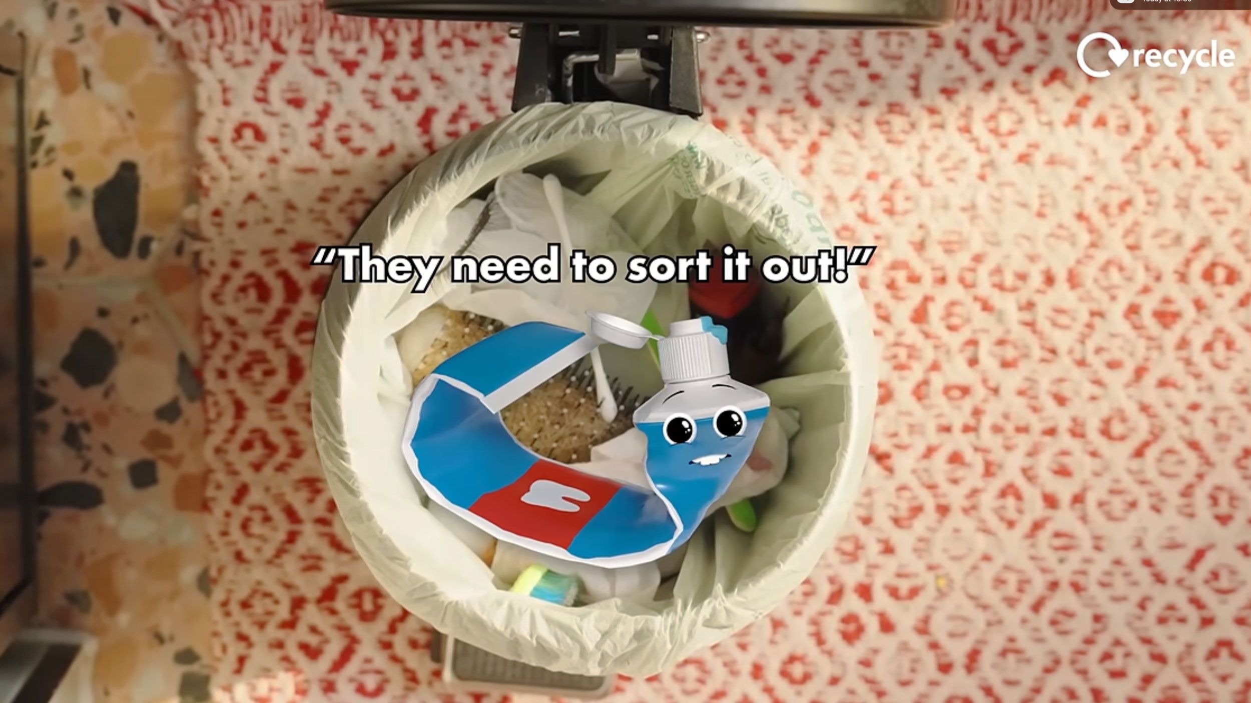 Image of animated toothpaste tube character in a bin