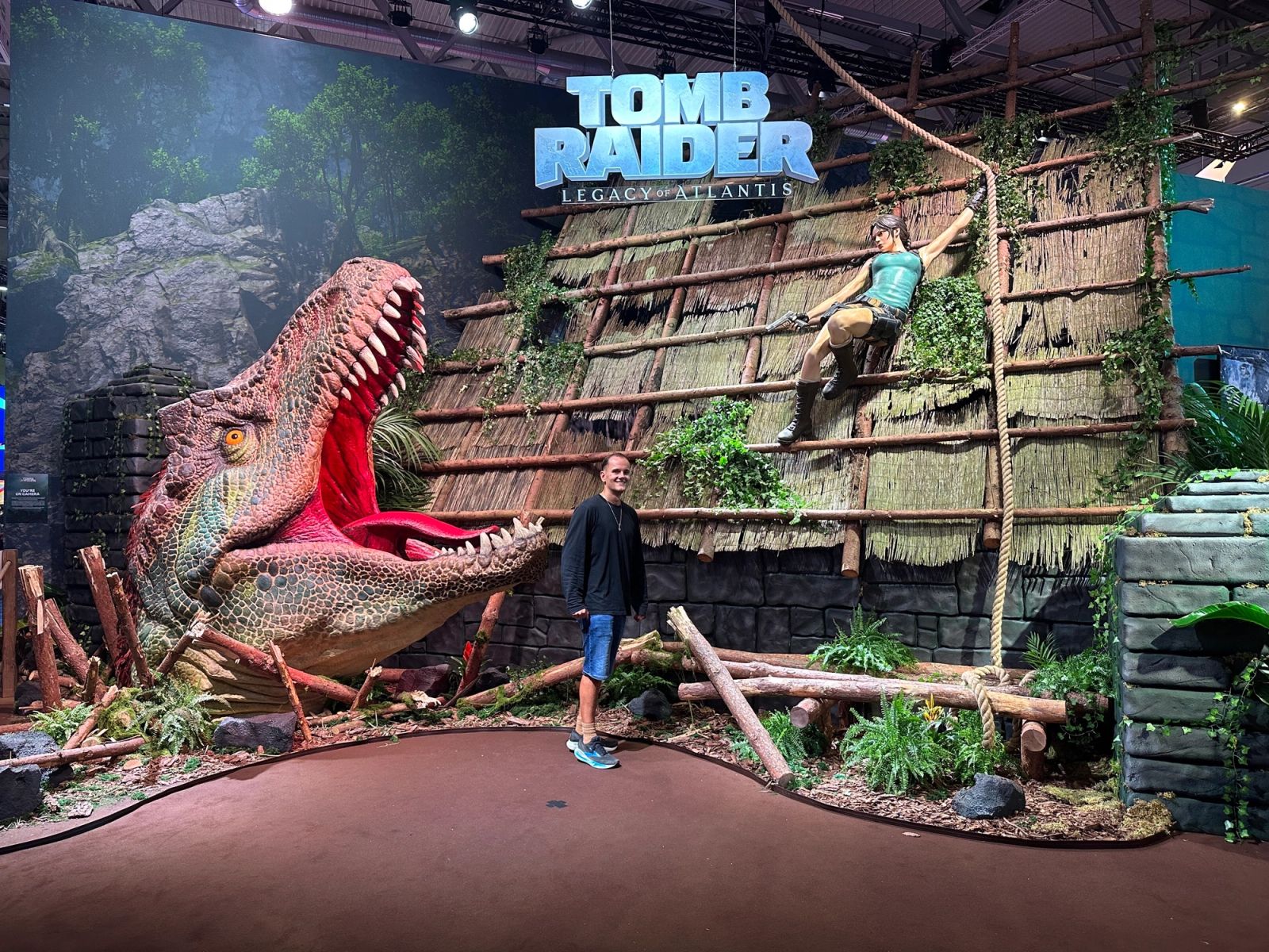 The Tomb Raider climbing wall, complete with T-Rex.