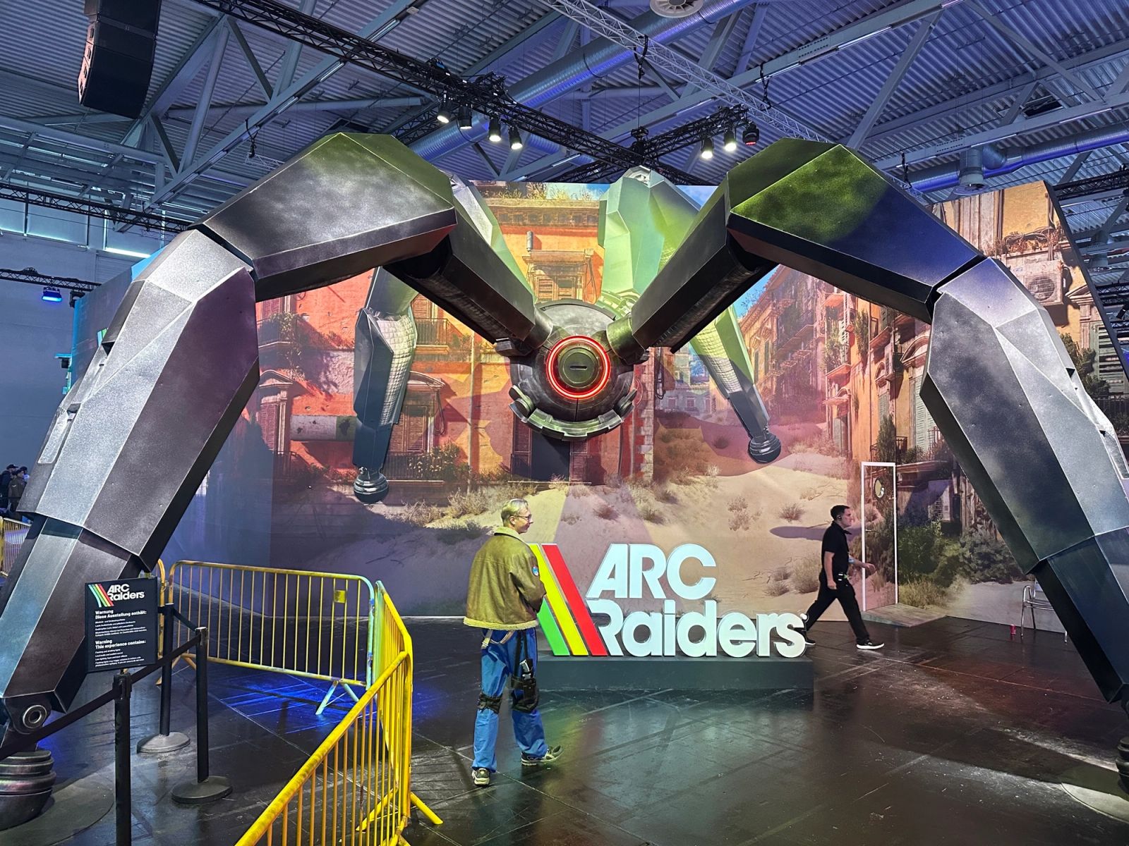 The Arc Raiders stand. The machine is roughly the size of the problem.