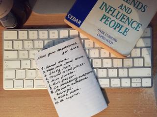 Notebook with writing on a desk