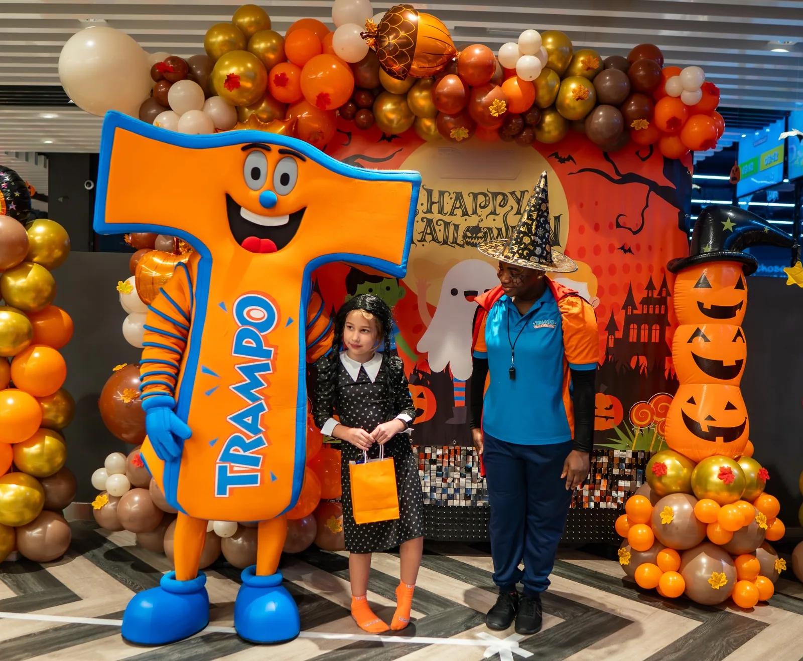 The Trampo mascot with a child in costume