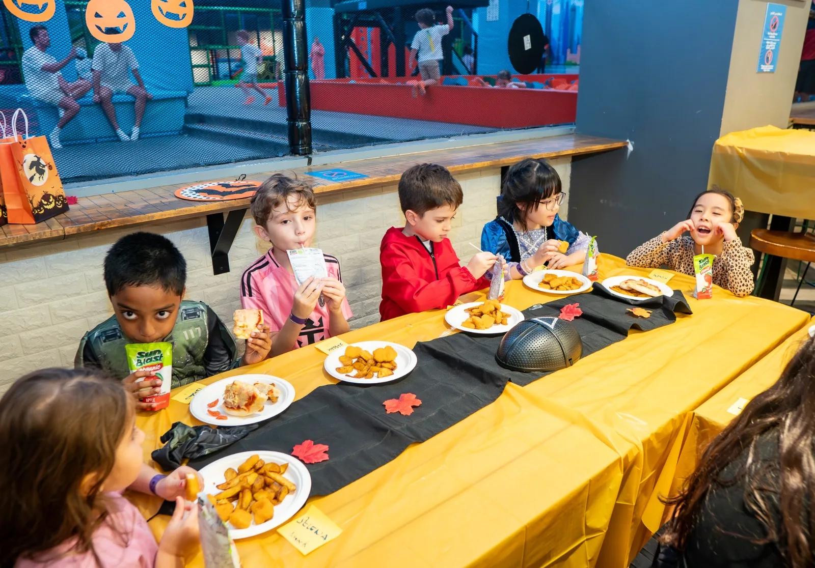 Kids at the Halloween Party table