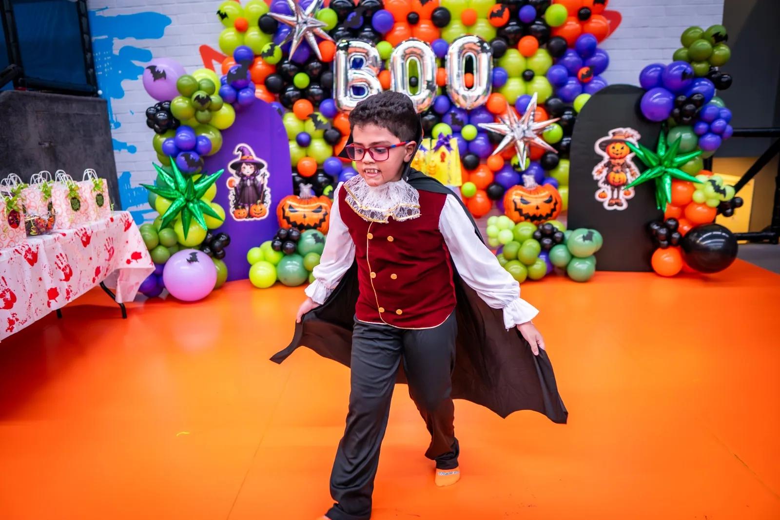 Child in a vampire costume at the costume competition